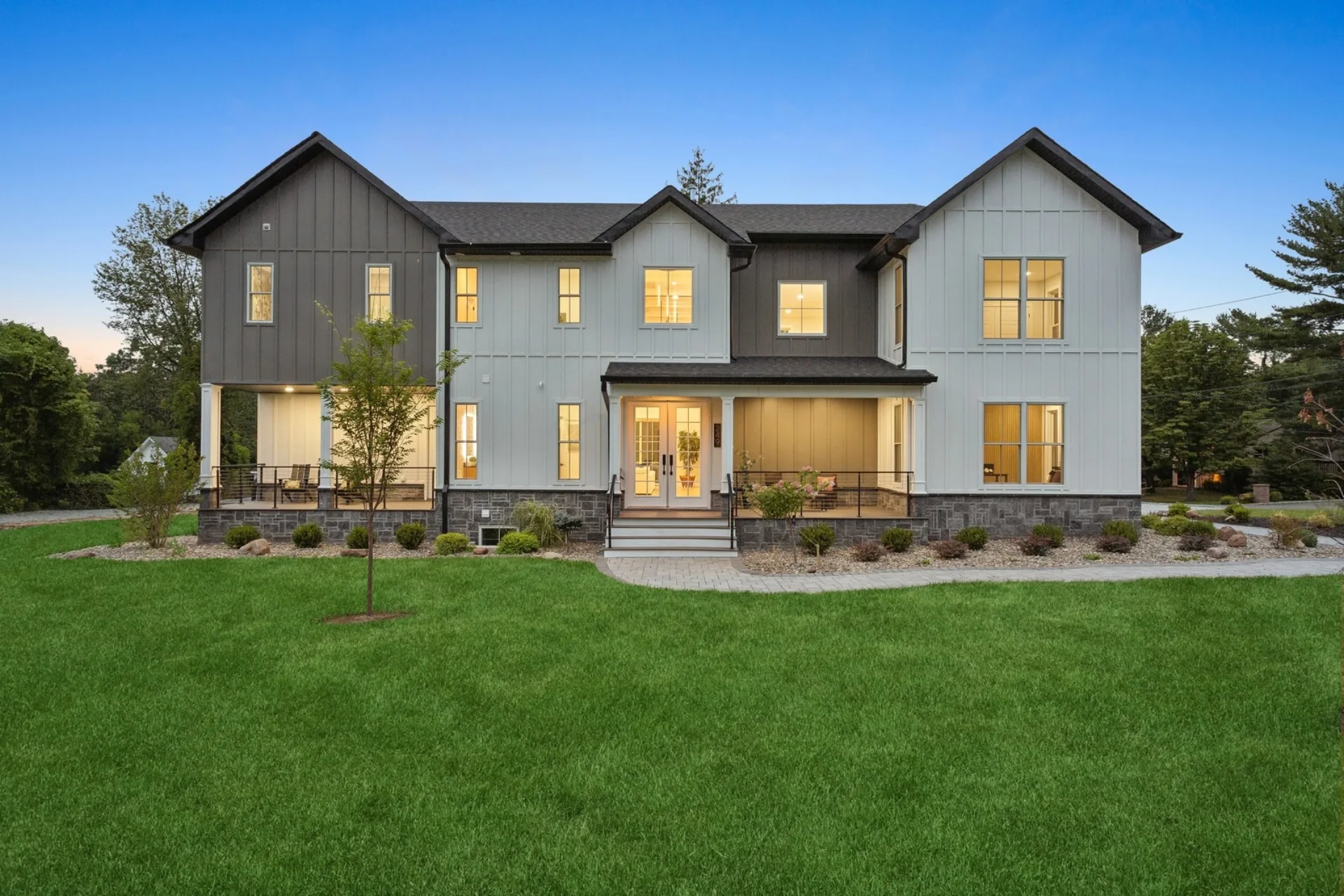Luxury custom home at twilight by Build Better Live Happier — Woodcliff Lake, NJ