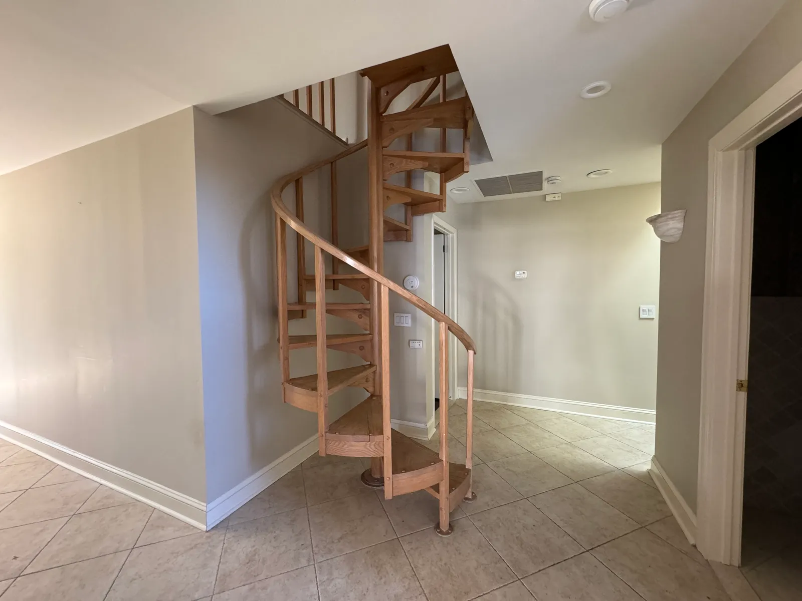 Original wooden spiral staircase before renovation