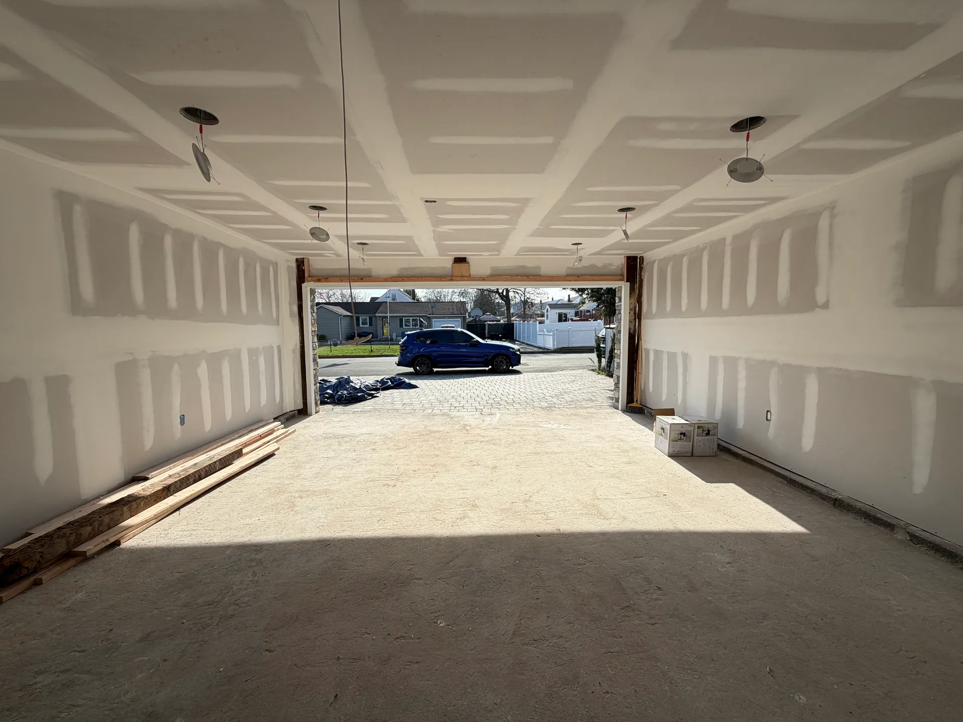 Rebuilt garage interior — insulated and drywalled with a coffered ceiling