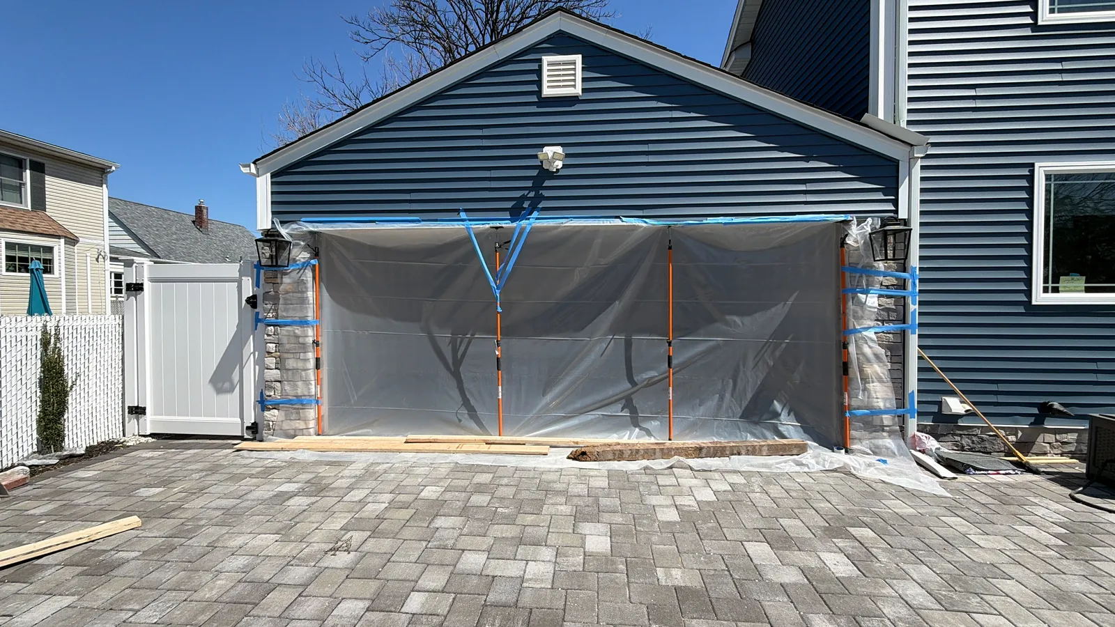Garage exterior masked off for finish coatings during the rebuild