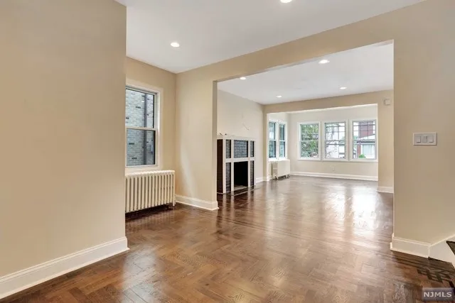 Finished open living area with refinished hardwood floors