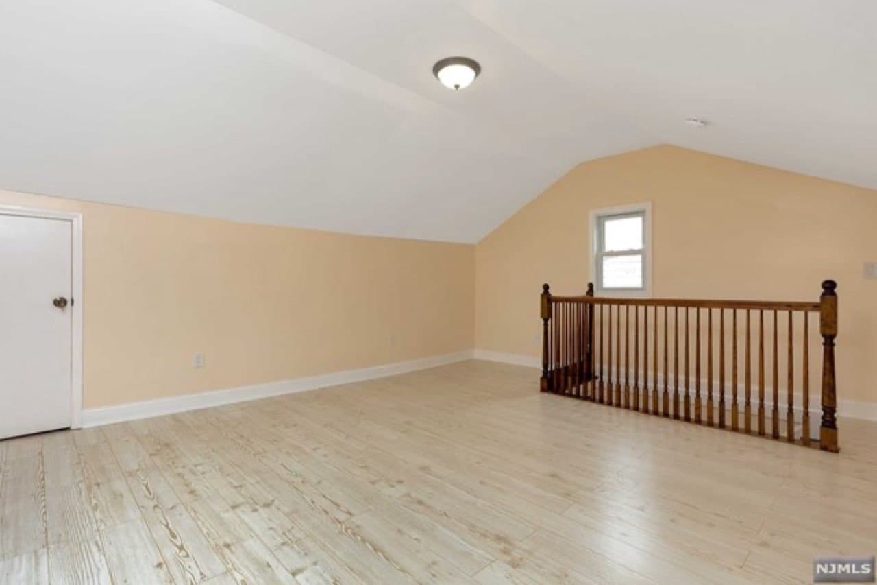 Finished attic level — bright bonus space with new flooring