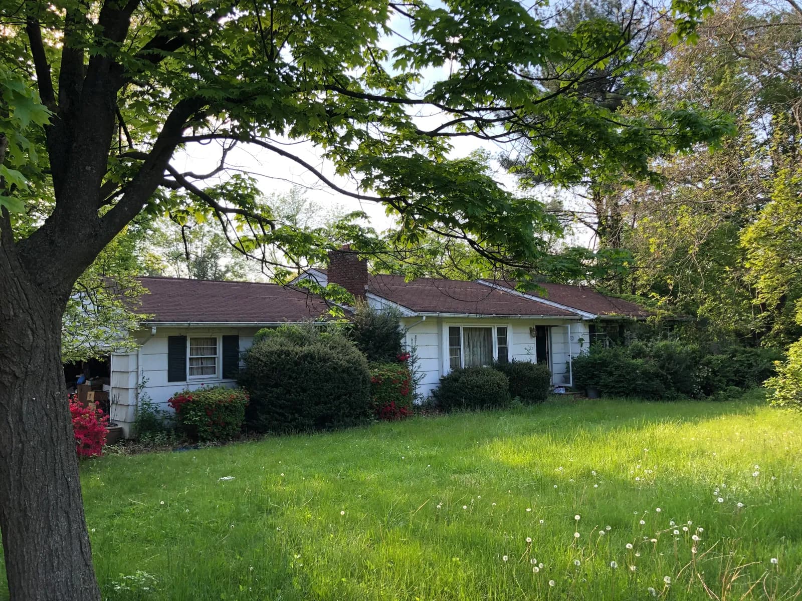 Original ranch home on the Franklin Lakes lot before demolition