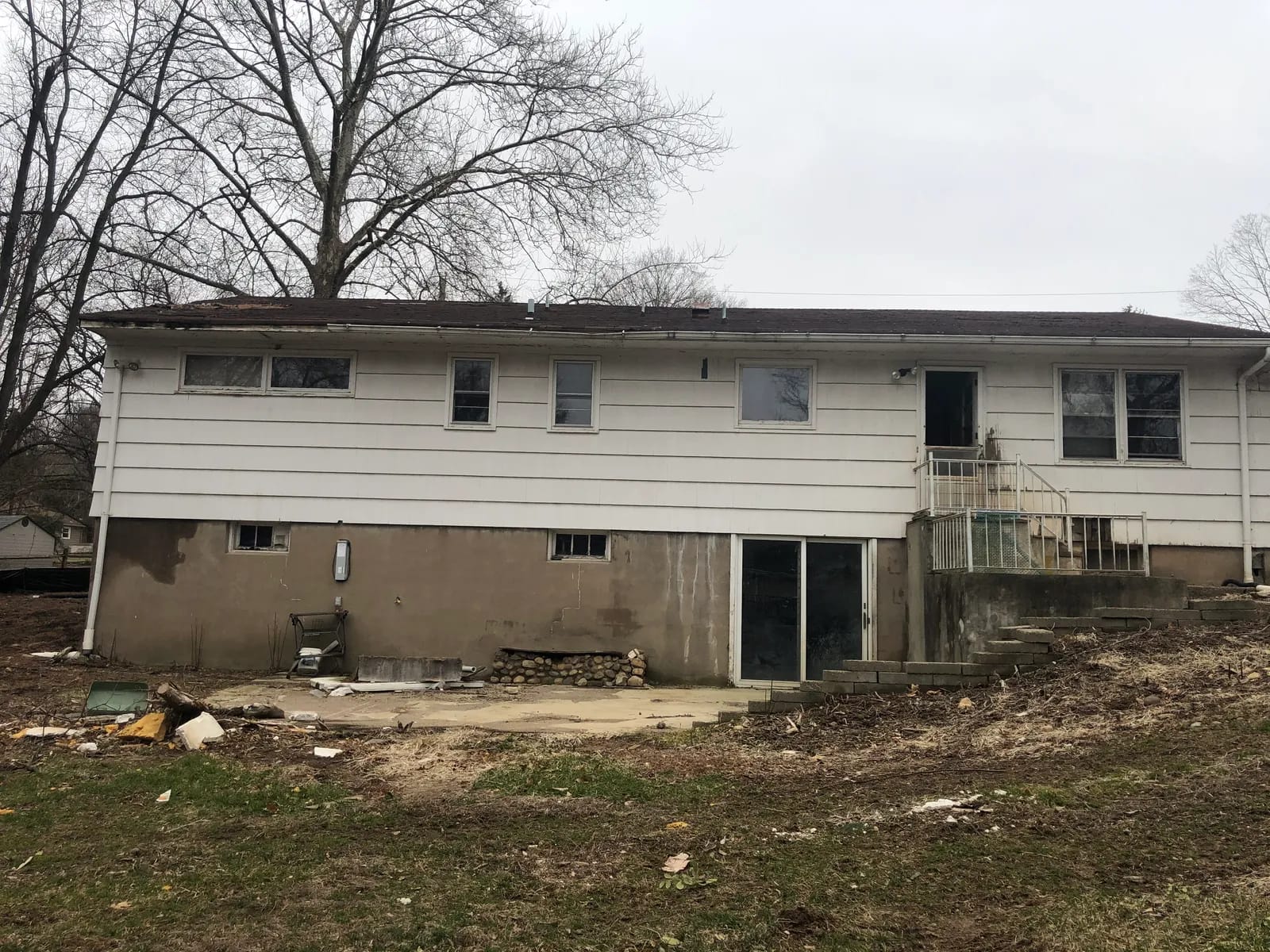 Rear of the original ranch home before demolition