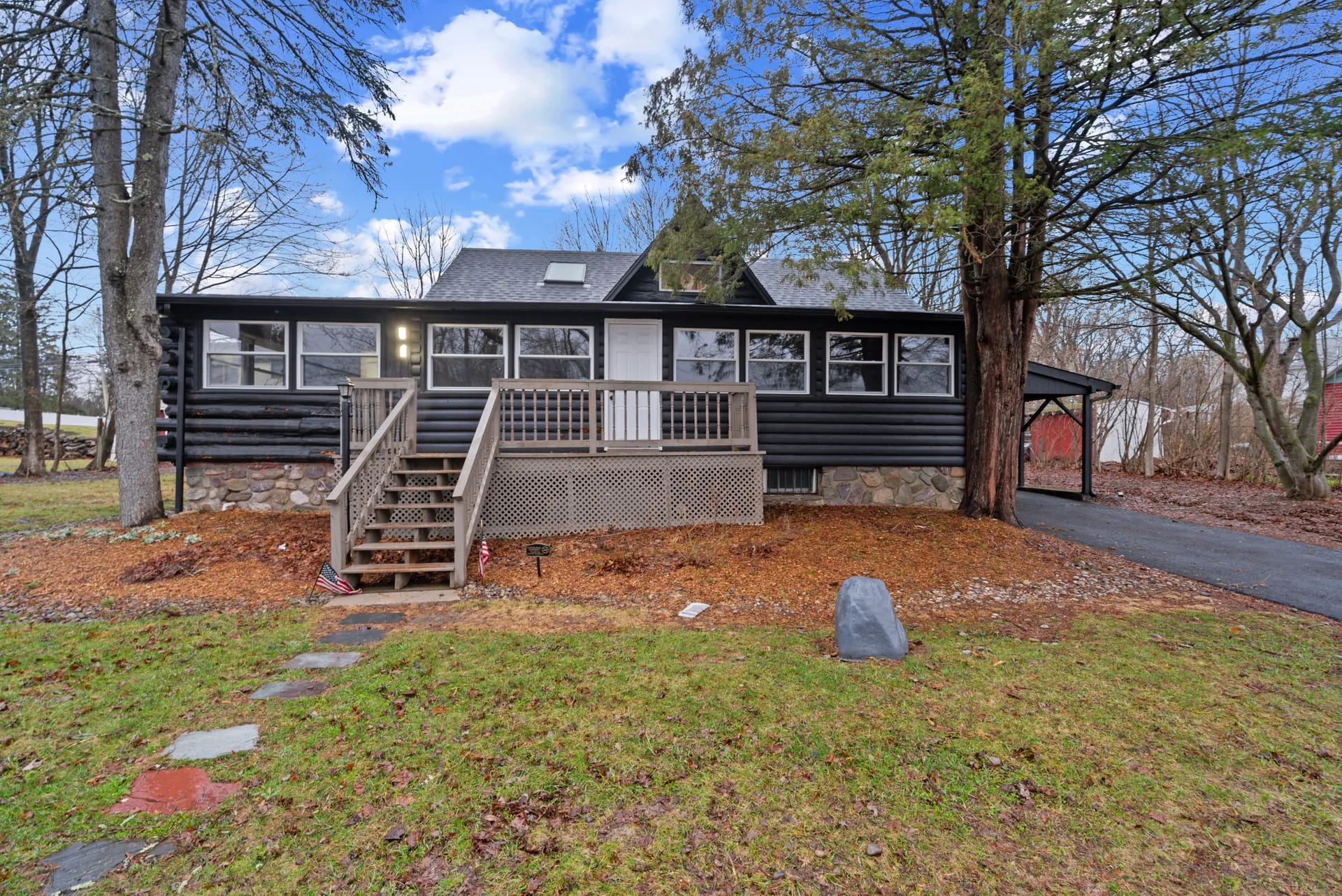 Log cabin Airbnb — West Milford, NJ — restored exterior with black stain