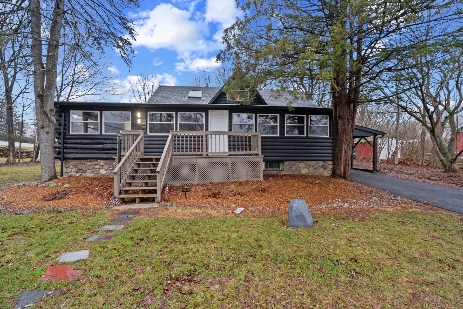 Log cabin Airbnb — West Milford, NJ — restored exterior with black stain