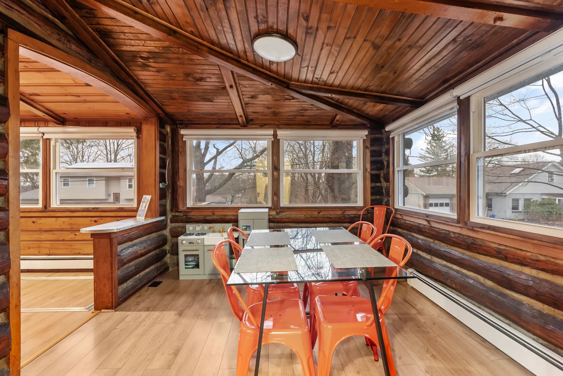 Finished sunroom dining area with new flooring