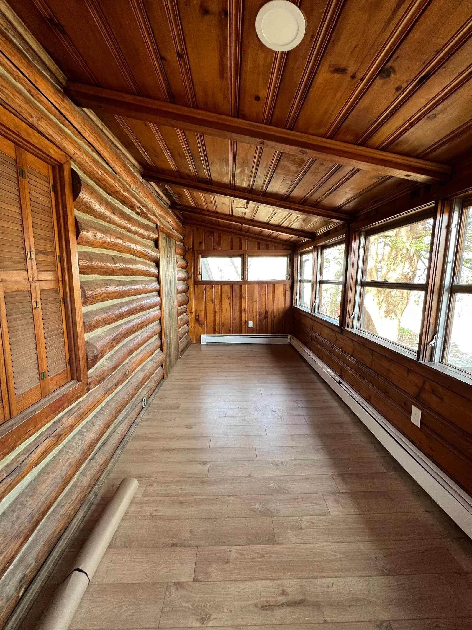 Empty log sunroom during renovation