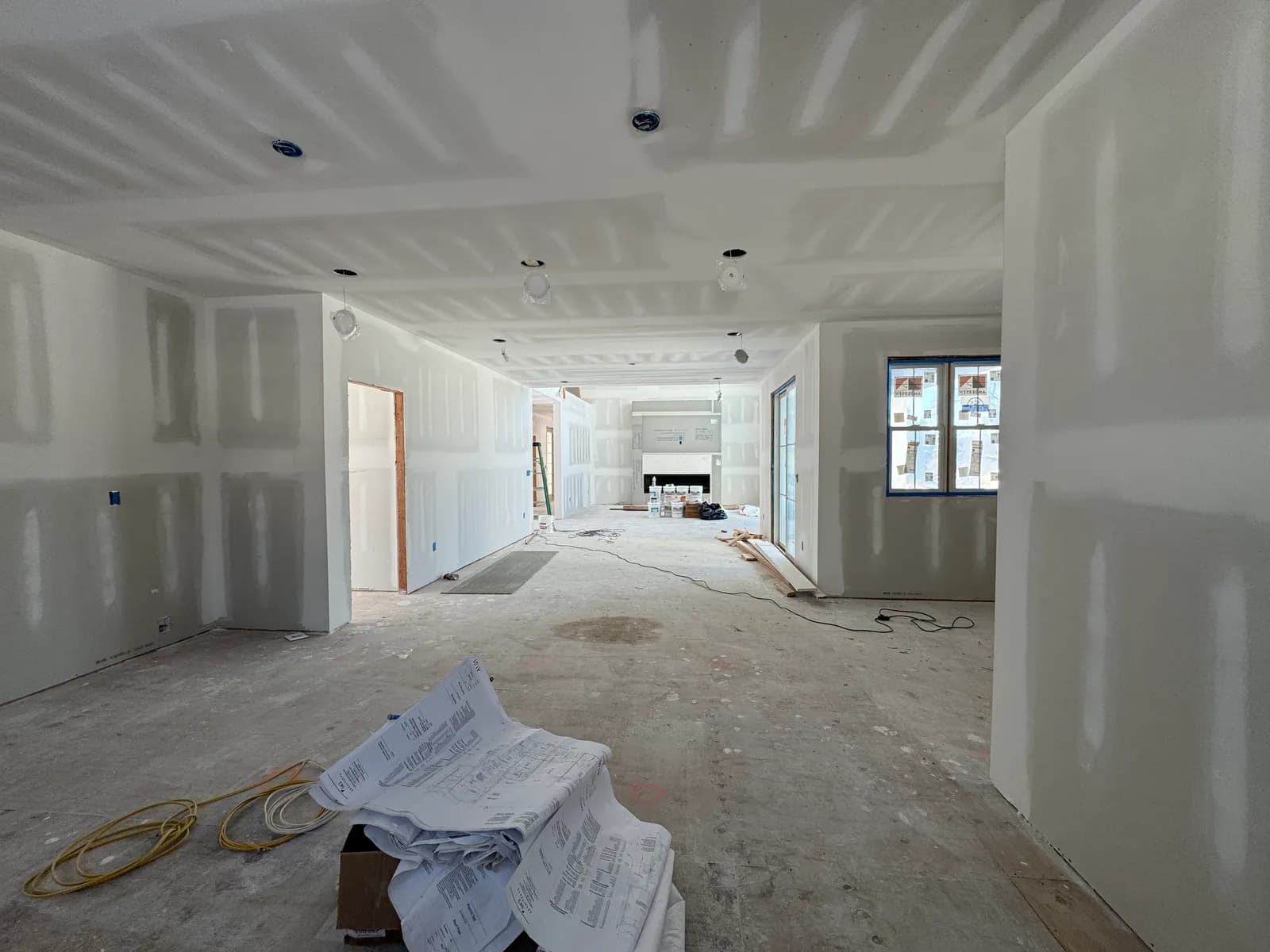 Double-height great room at the drywall stage