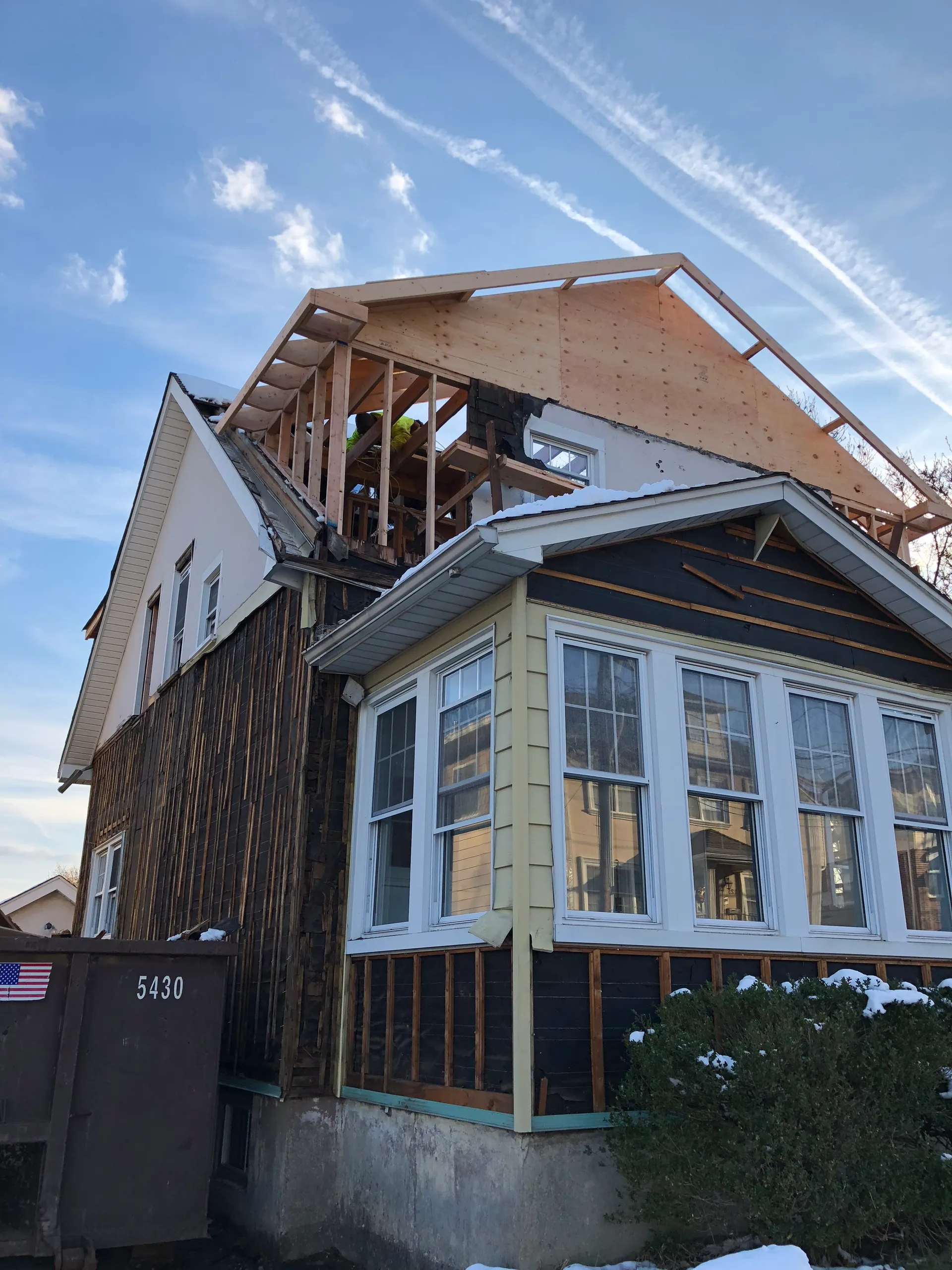 Roof raise and second-story framing during renovation