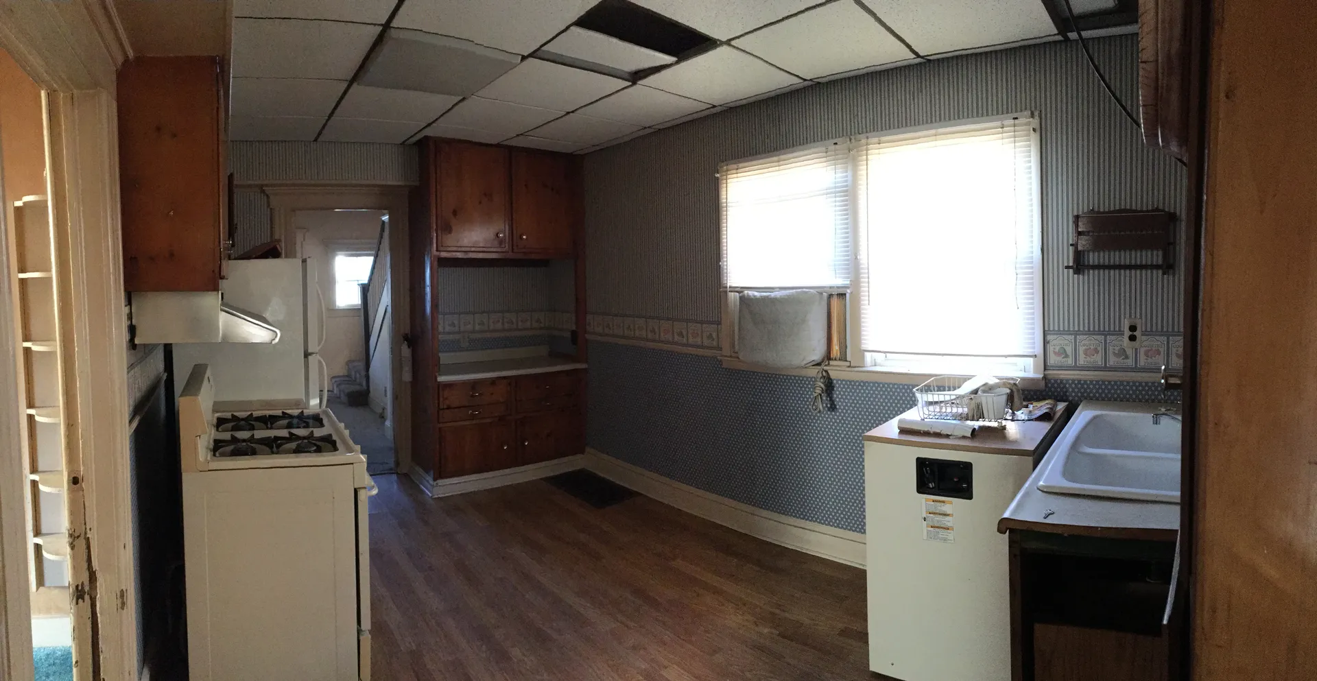 Original dated kitchen with drop ceiling before renovation