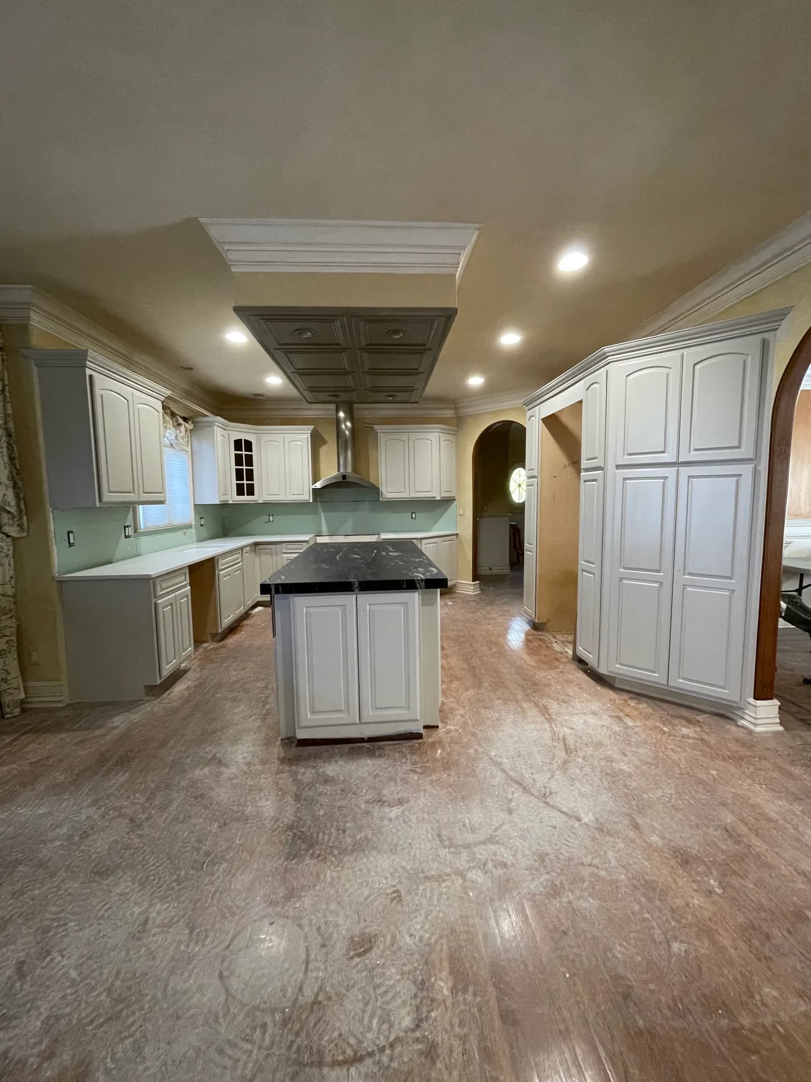 Wyckoff kitchen before renovation — dated cabinetry and worn island